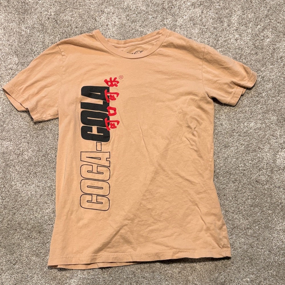 Coca-Cola Beige T-Shirt with Bold Black and Red Logo